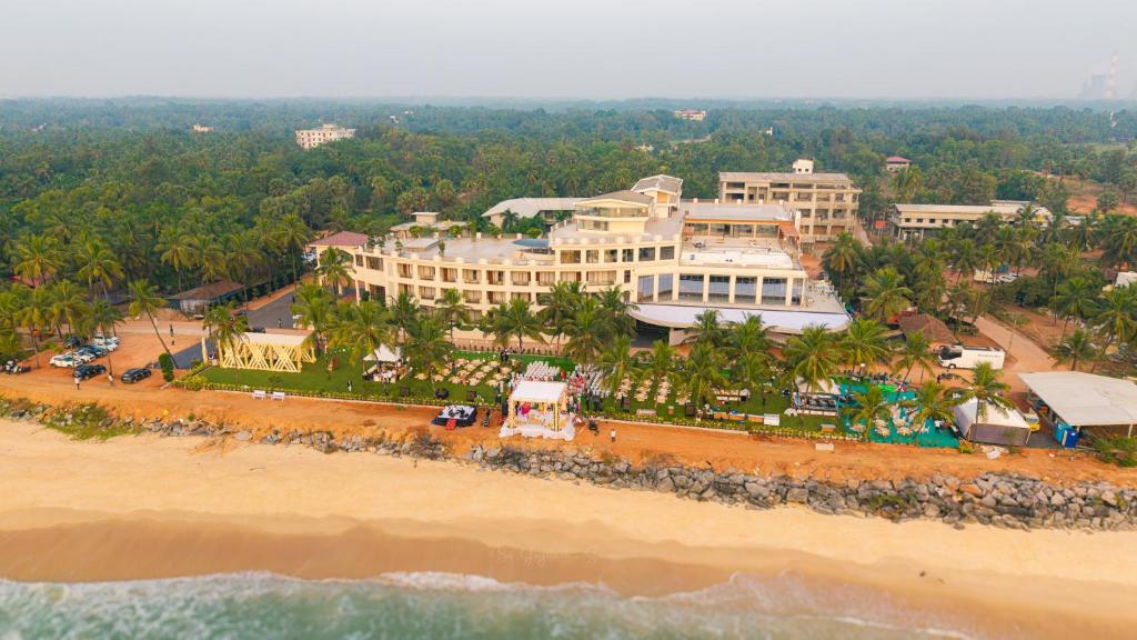an aerial view of a resort on the beach at Peninsula Del Mar Beach Resort in Udupi