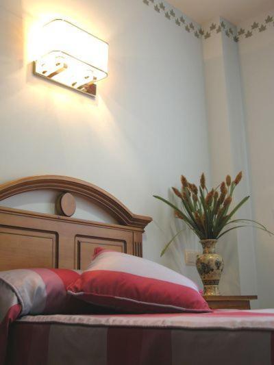 Postel nebo postele na pokoji v ubytování Hostal la Cepa