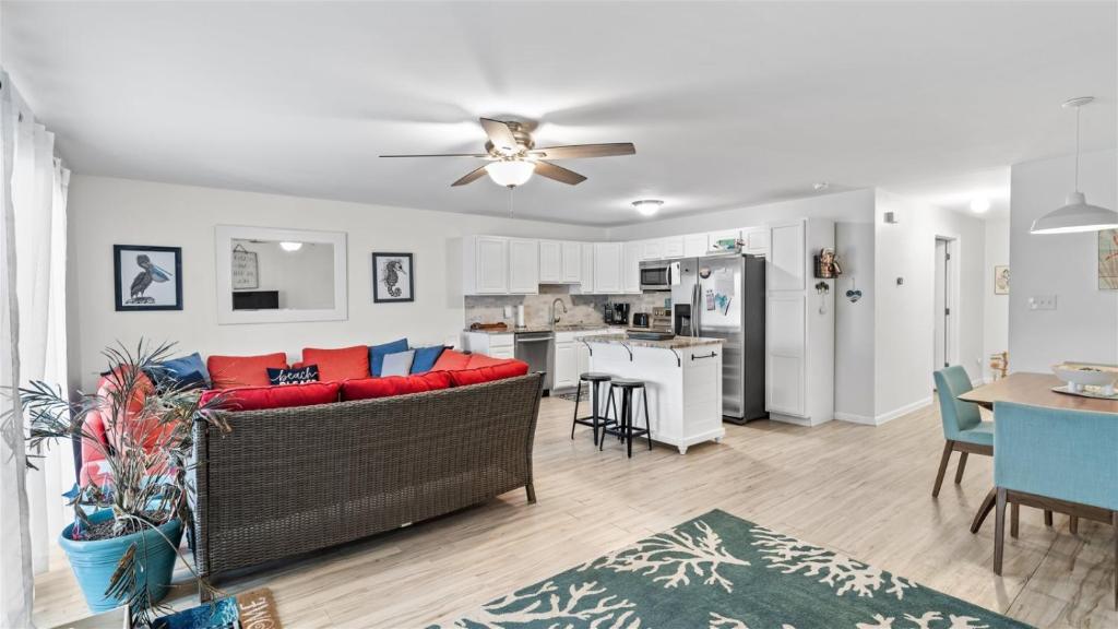a living room with a couch and a kitchen at 209 E Andrews Ave, Unit A in Wildwood