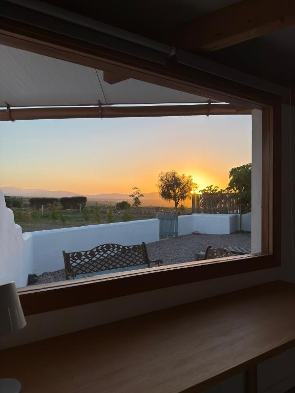 a view of a sunset through a window at La Tierrua home in Tefía
