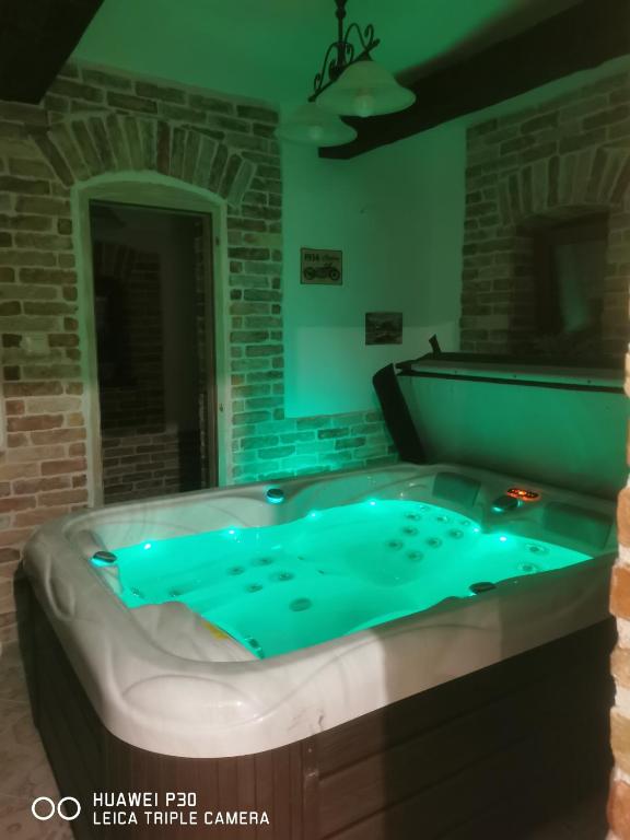 a jacuzzi tub with blue lights in a room at Kúria Apartman Private Wellness in Budapest