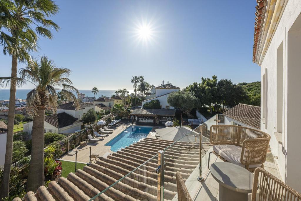 a view of a swimming pool from a house at Stunning 5-Bed Villa with Private Pool in Manilva