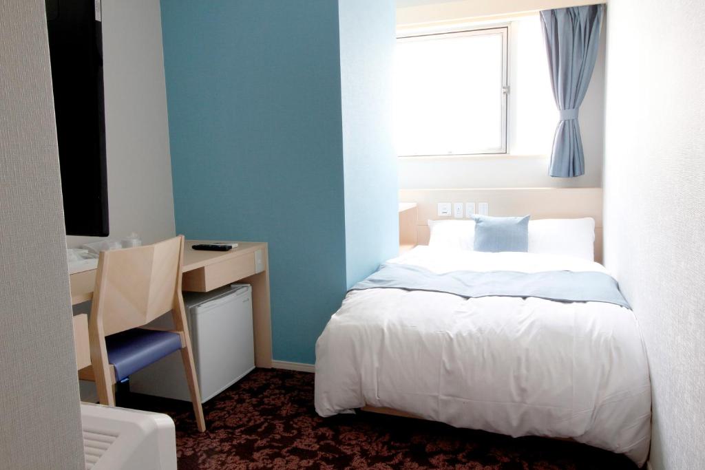 Postel nebo postele na pokoji v ubytování Hotel M Matsumoto