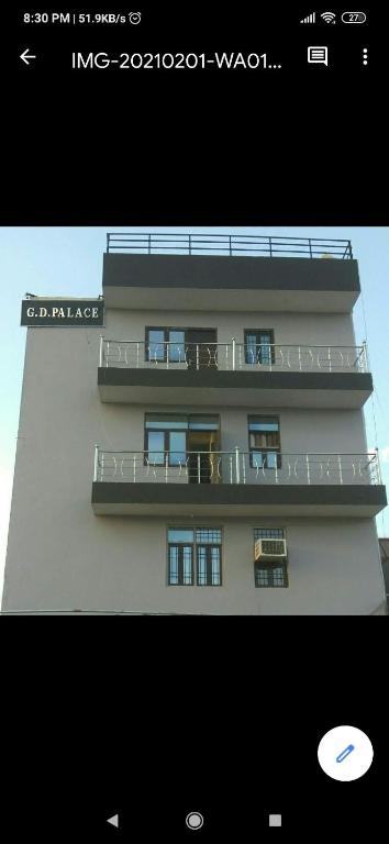 a building with two balconies on the side of it at G d palace in Gwalior