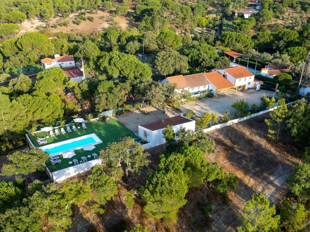 an aerial view of a house with a swimming pool at Paço no Monte by Stay ici in Montargil