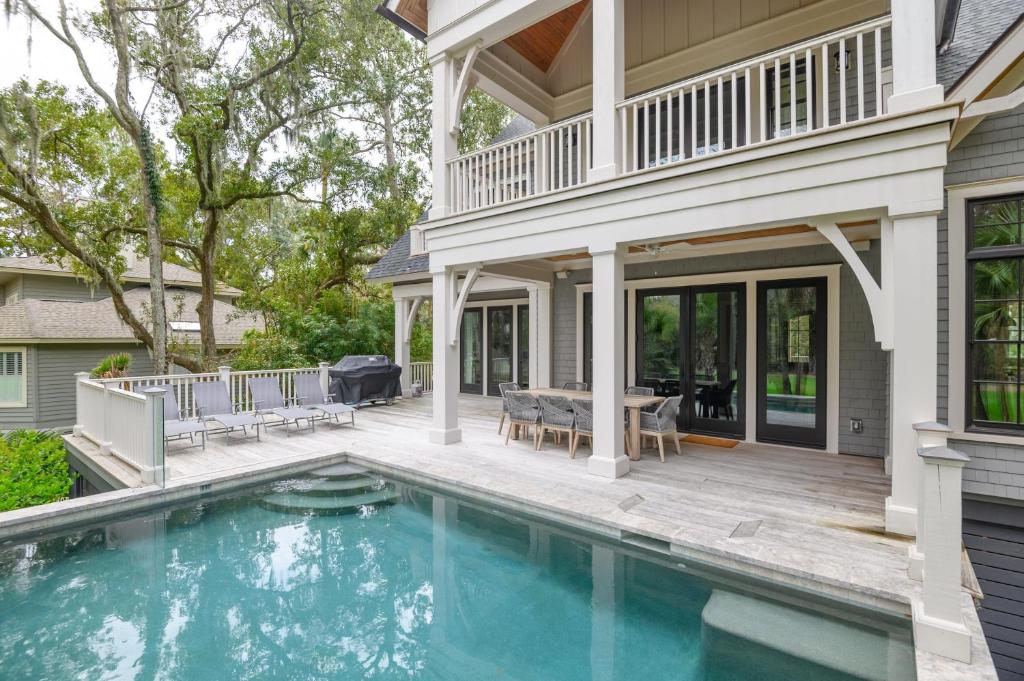 a house with a swimming pool and a patio at 233 Glen Abbey in Kiawah Island