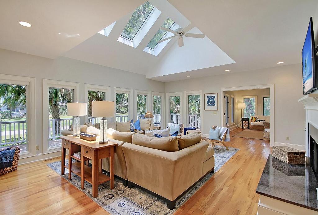 a living room with a couch and a fireplace at 13 Angler Hall in Kiawah Island