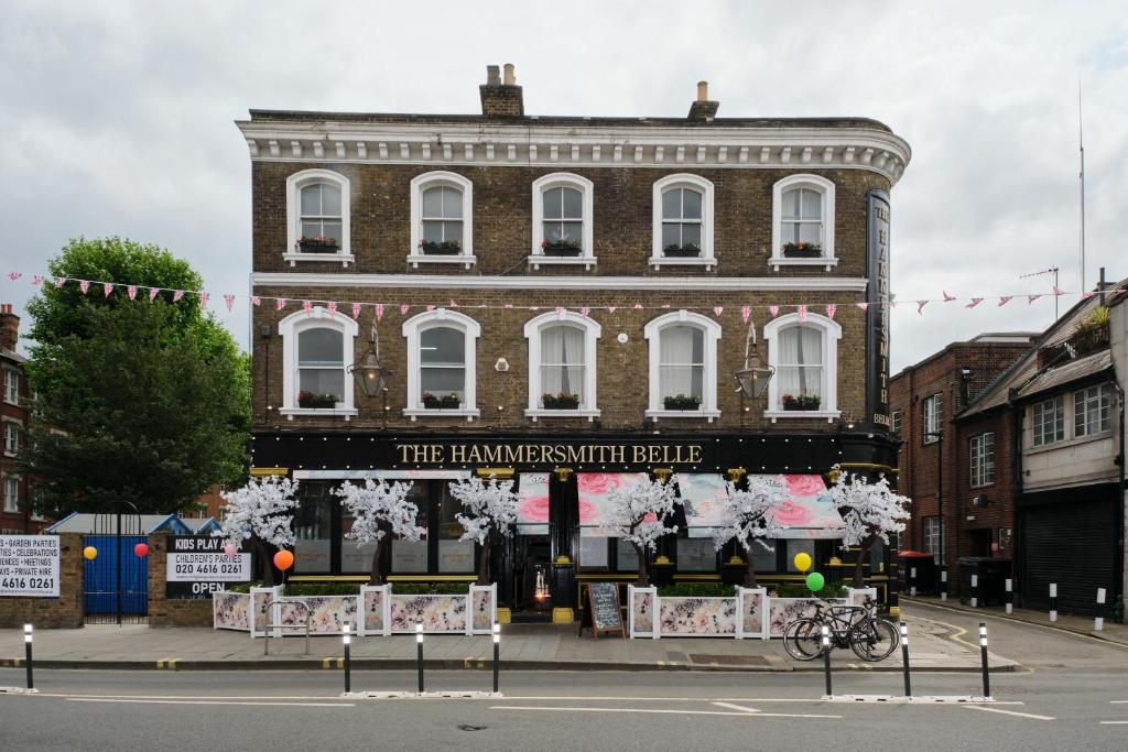 a large brick building with a sign in front of it at Hammersmith Belle in London