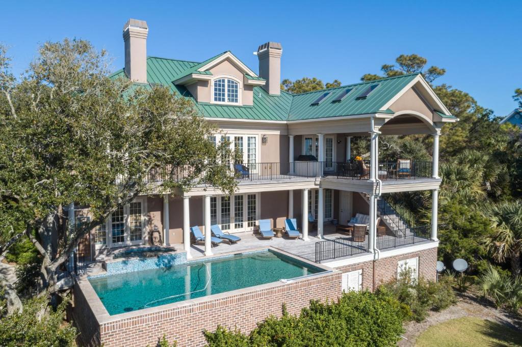an aerial view of a house with a swimming pool at 15 Ocean Course in Kiawah Island