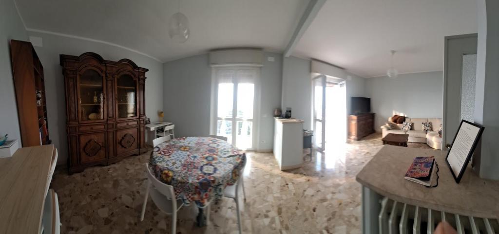 a large living room with a couch and a table at Bella Vista in Canelli