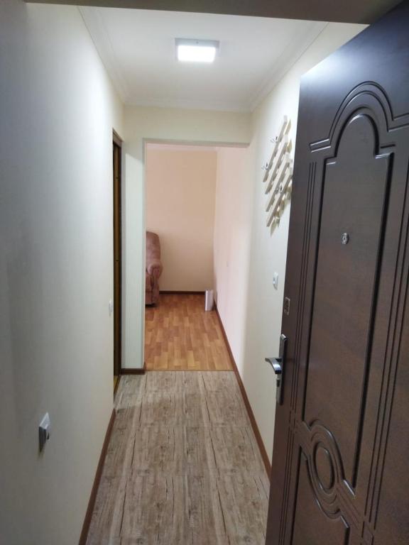 a hallway with a door leading to a room at Vadamar Apartment in Sisian