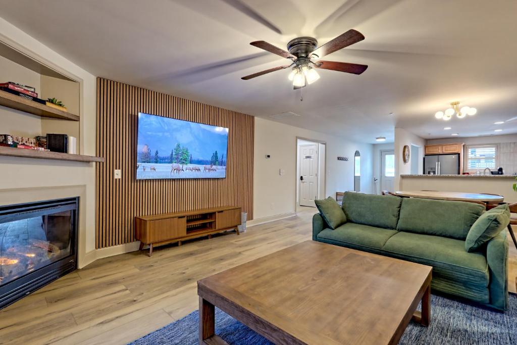 a living room with a couch and a fireplace at Alpine Retreat in Helen