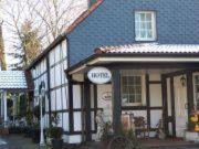 a house with a sign on the front of it at Kämpgens – Hof in Mülheim an der Ruhr