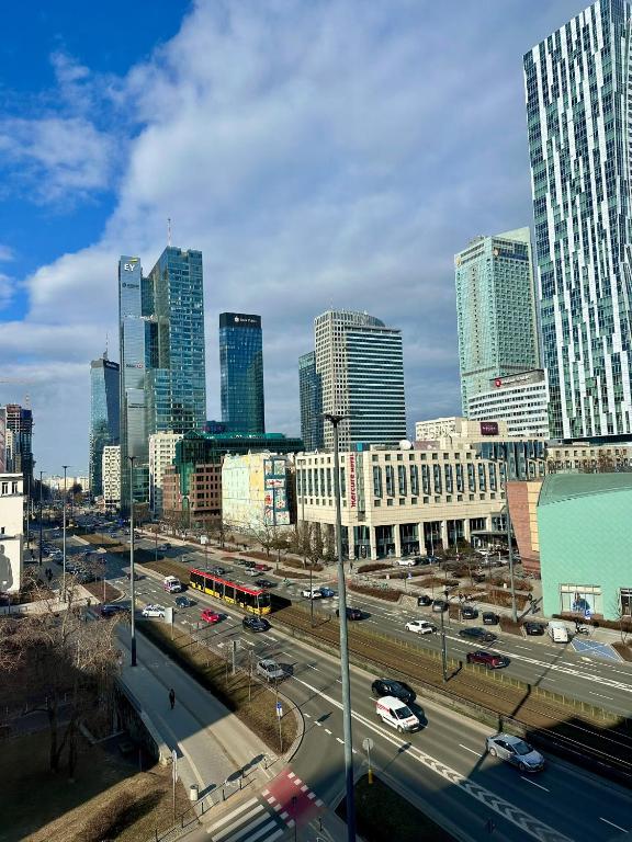 a city with a highway in front of tall buildings at Chmielna Residence in Warsaw