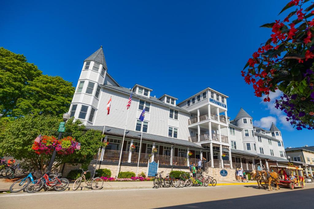 a large white building with bikes parked in front of it at Lake View Hotel in Mackinac Island