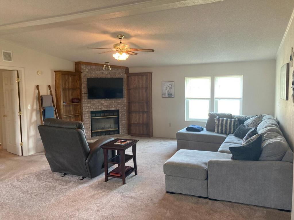 a living room with a couch and a fireplace at High Plains Hideout 3 bedrooms 2 Baths in WaKeeney