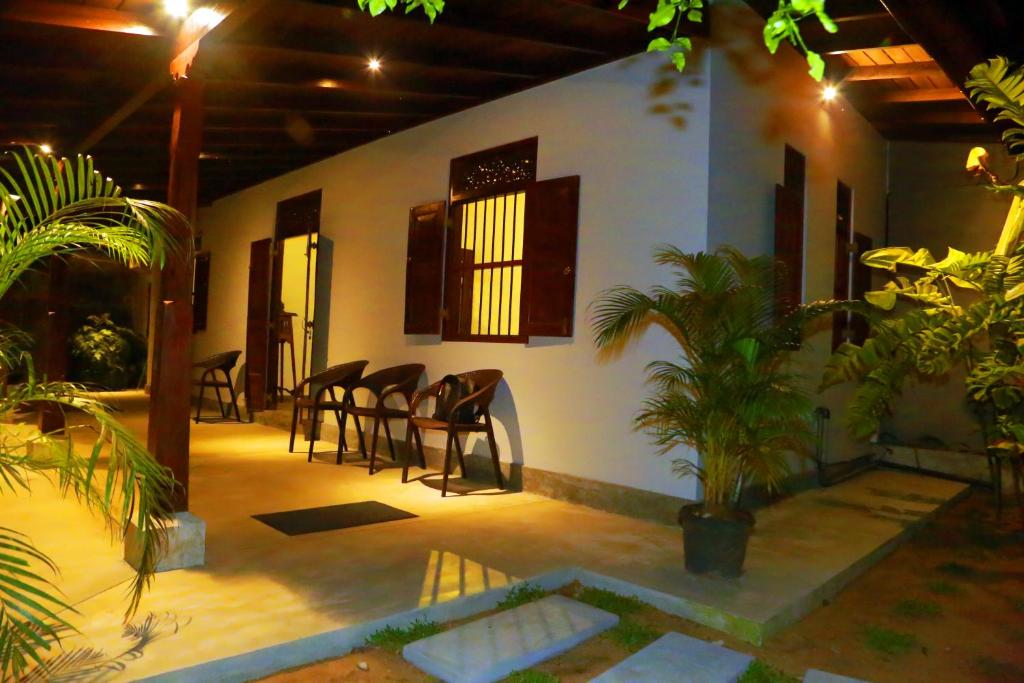 a room with chairs and a table in a house at Muraaya in Habaraduwa Central