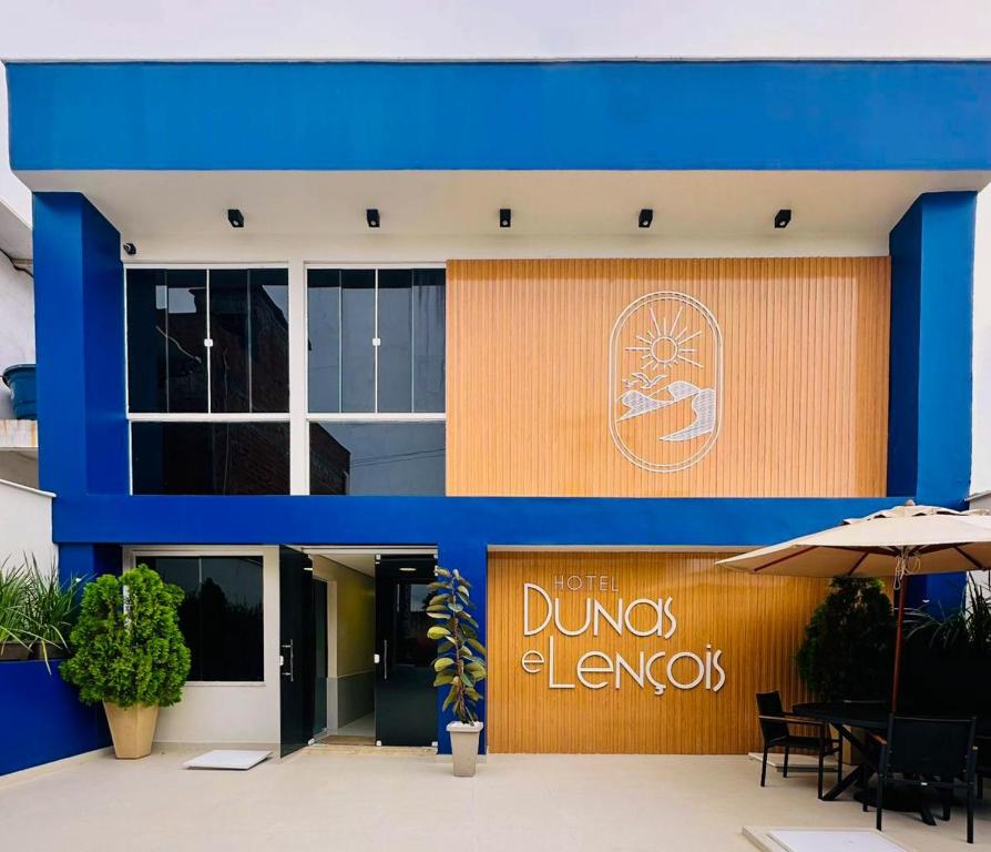 a blue and orange building with a sign on it at Hotel Dunas e Lençóis in Barreirinhas