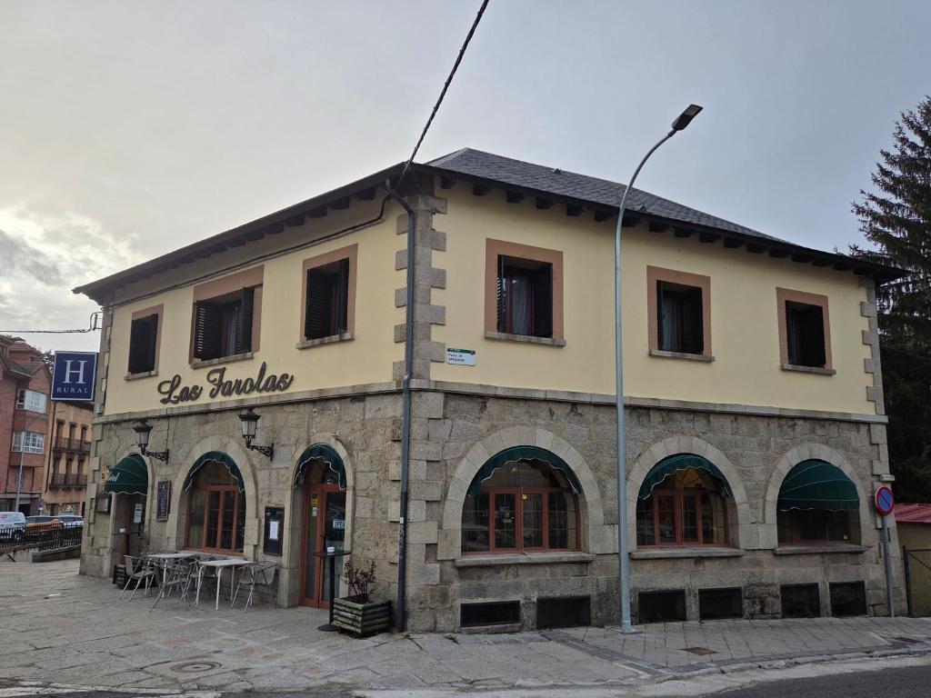 a building on the corner of a street at Hotel Rural Las Farolas in San Rafael