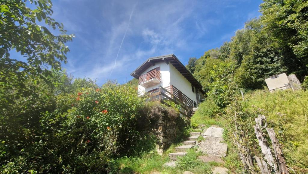 a small house on the side of a mountain at Baita del Silenzio in Miazzina