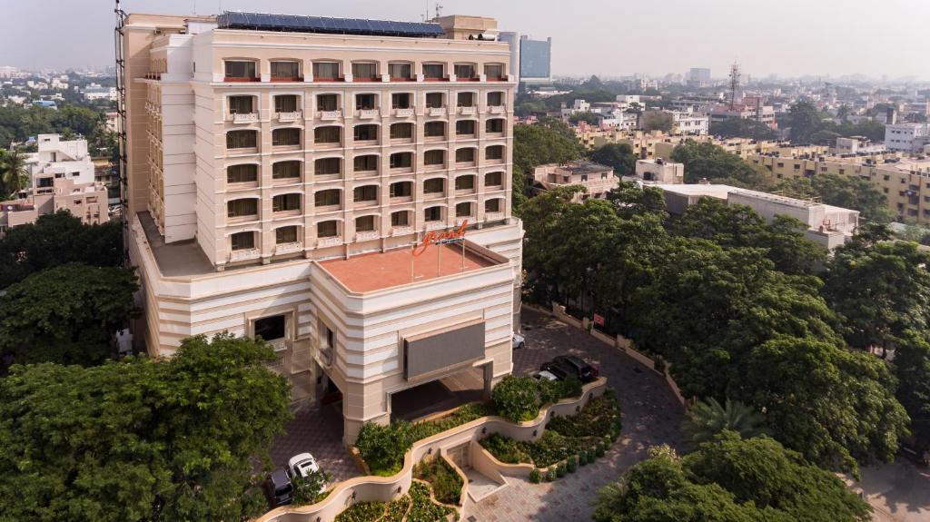 an overhead view of a white building with trees at Grand Chennai by GRT Hotels in Chennai