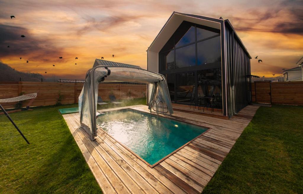 a house with a swimming pool in a yard at Rubis Villa Bungalov in Elmalık