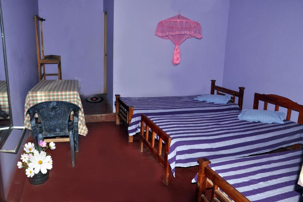Postel nebo postele na pokoji v ubytování Hotel Pearl Gate