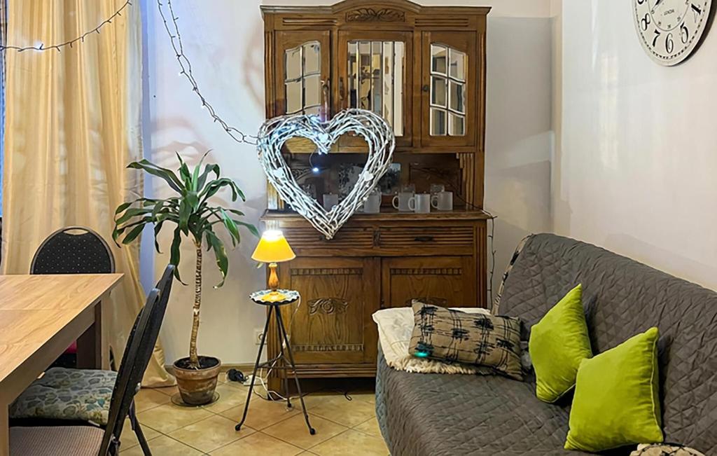 a living room with a couch and a wooden cabinet at Stunning Home In Rybical With Wifi in Rybical