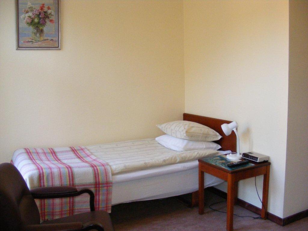 Postel nebo postele na pokoji v ubytování Hotel Continental Malmö