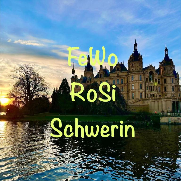 a castle sitting on top of a body of water at FeWo RoSi SN in Schwerin