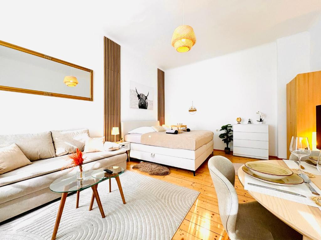 a living room with a couch and a bed at Katys Cozy Corner - Self CheckIn in Graz