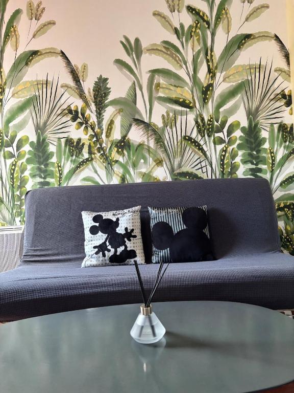 a blue couch with pillows on top of a table at Disneyland Family Studio in Magny-le-Hongre