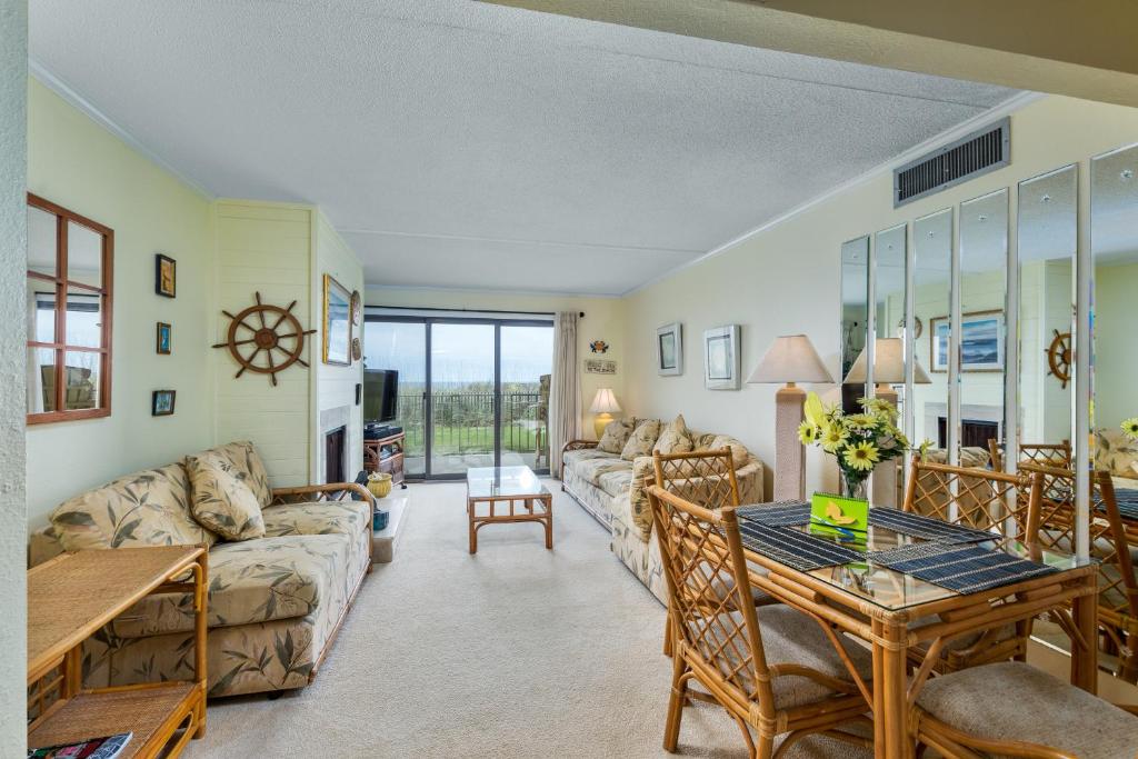 a living room with a couch and a table at 5695 - Pelican's Perch in Nags Head