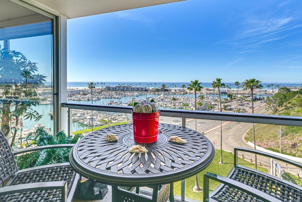a table on a balcony with a view of the beach at Beachfront, Amazing 180-Degree View in Oceanside
