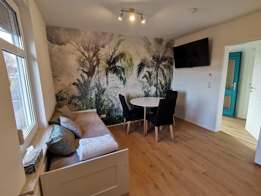 a living room with a couch and a table at Wohnung Werratal Blick in Dankmarshausen