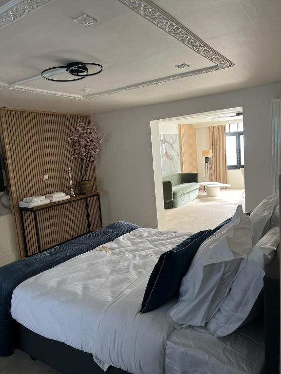 a bedroom with a bed and a living room at Modern Ground Floor Apartment in Ghent