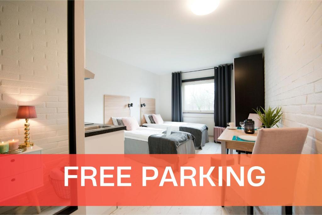 a rendering of a hotel room with text free parking at Halmstad Hotel Apartments in Halmstad