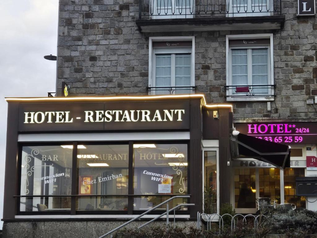 a hotel restaurant sign in front of a building at Hotel le Saint Germain in Flers