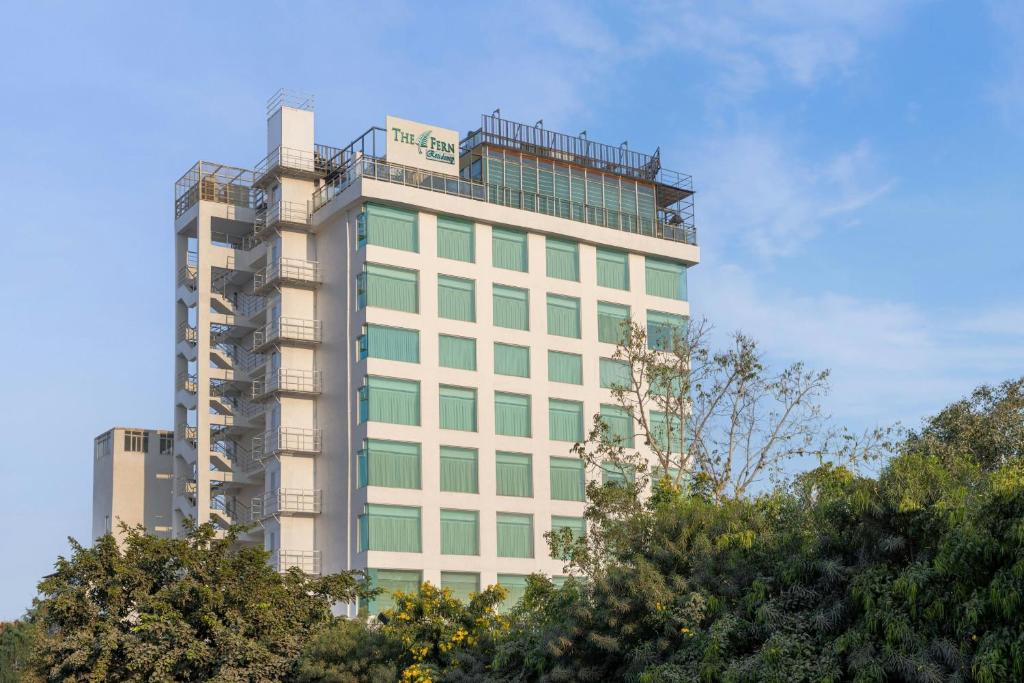 a tall building with a sign on top of it at The Fern Residency Jodhpur, Series by Marriott in Jodhpur