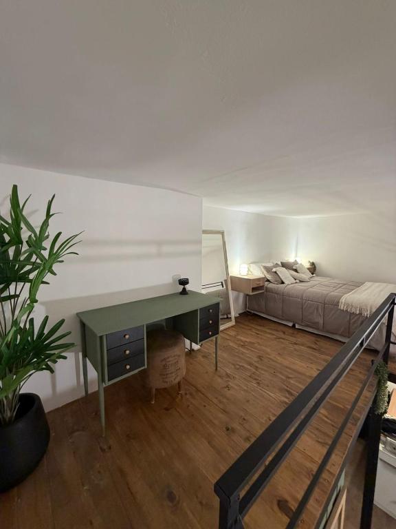 a living room with a desk and a bed at Apart Hotel CABA in Buenos Aires