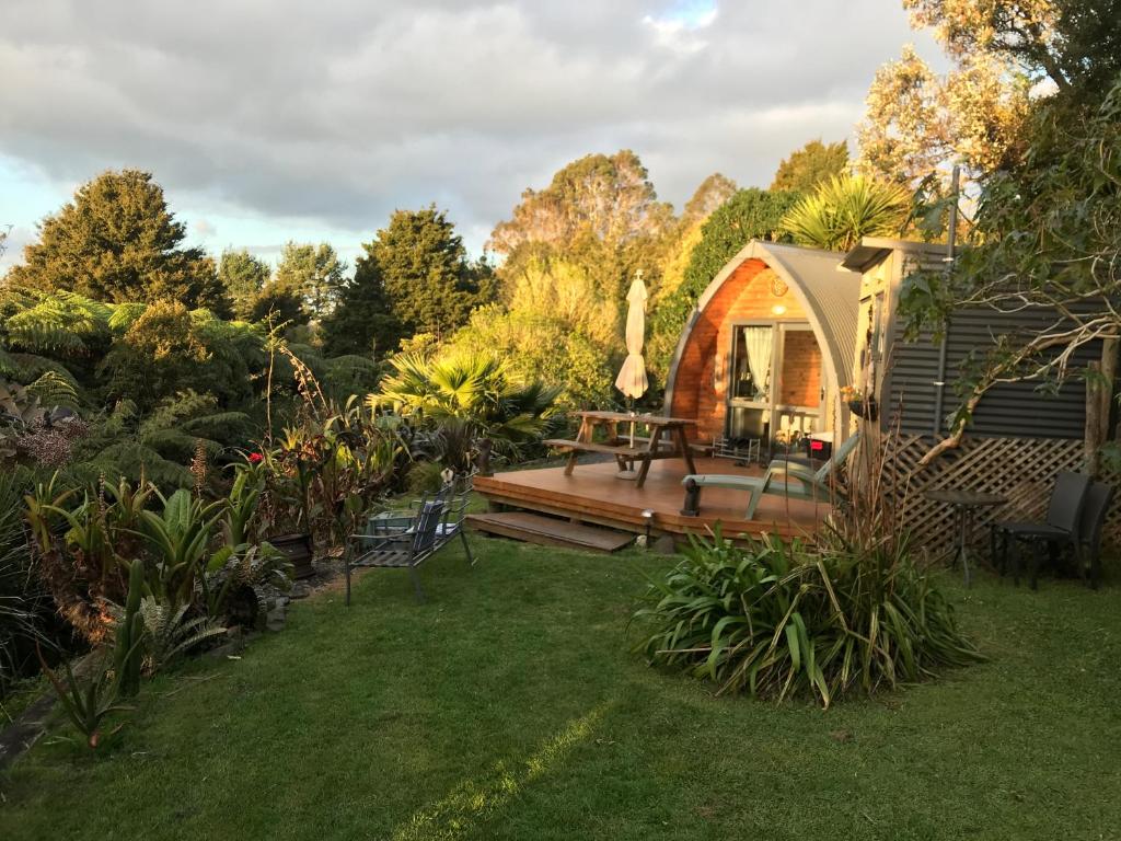 a garden with a gazebo in a yard at The Dome Waikino in Waikino