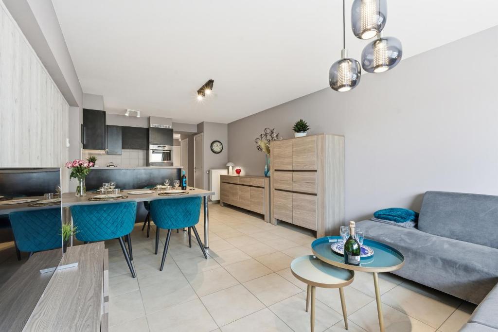 a living room and kitchen with a couch and a table at Walter Vilain 0301 G in Sint-Idesbald