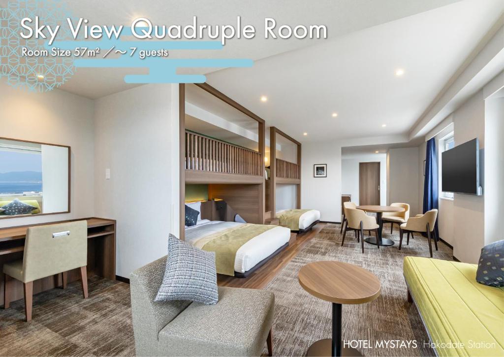a hotel room with a bed and a desk at HOTEL MYSTAYS Hakodate Station in Hakodate