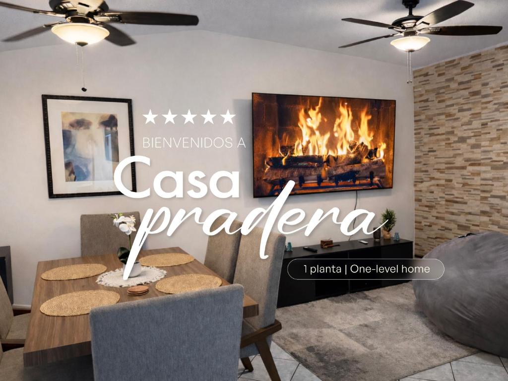 a dining room with a fireplace in a living room at Casa Pradera in Manuel F. Martínez