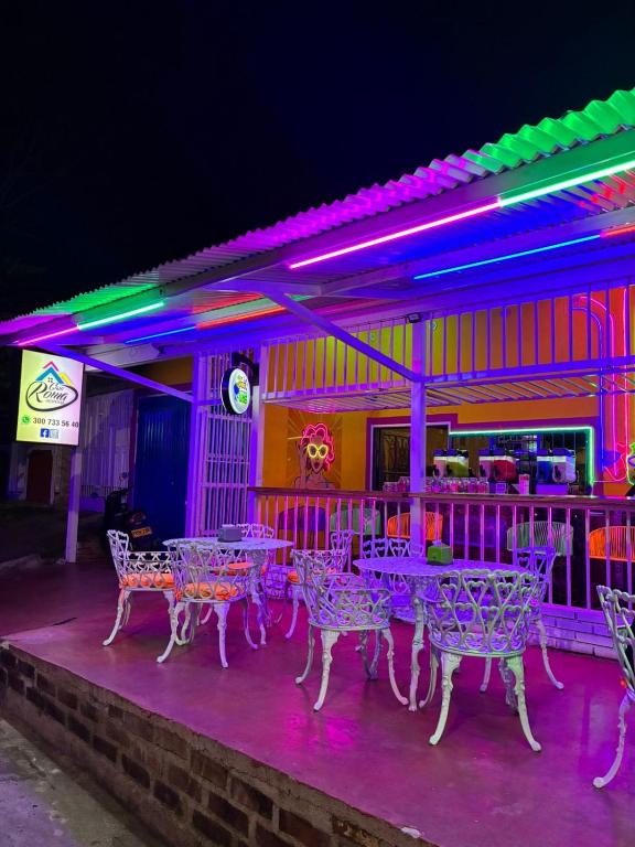 a table and chairs outside of a restaurant at night at Casa Roma in Rivera