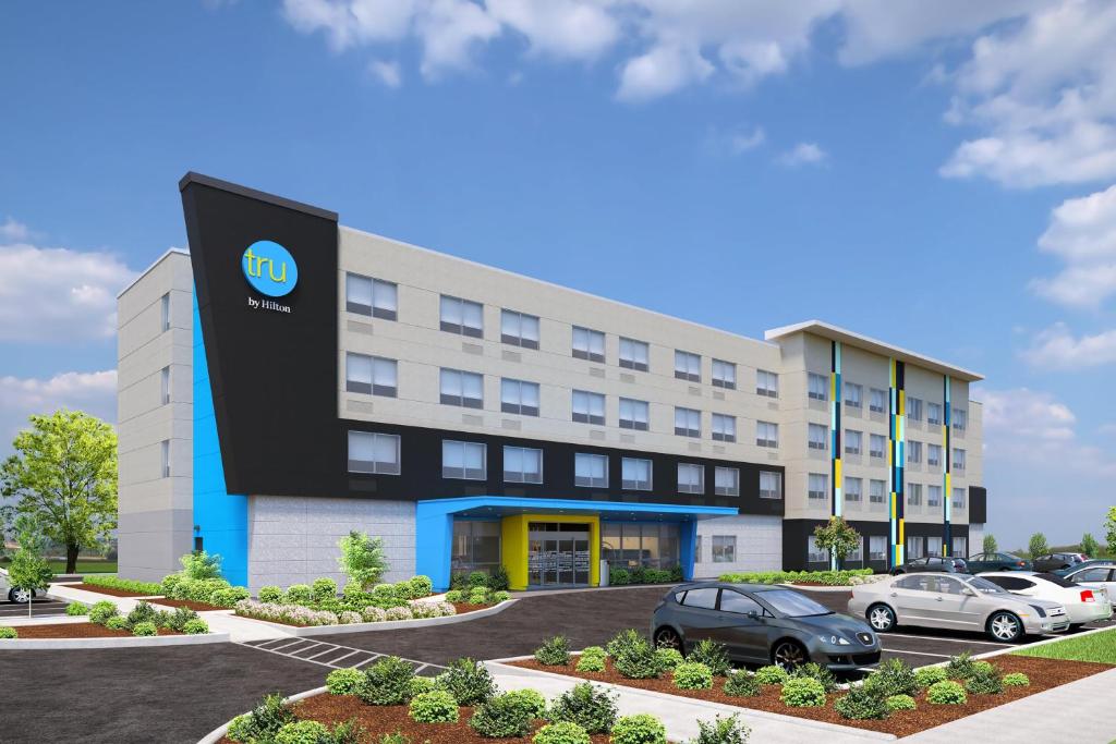 a rendering of a building with cars parked outside at Tru By Hilton Milton in Milton