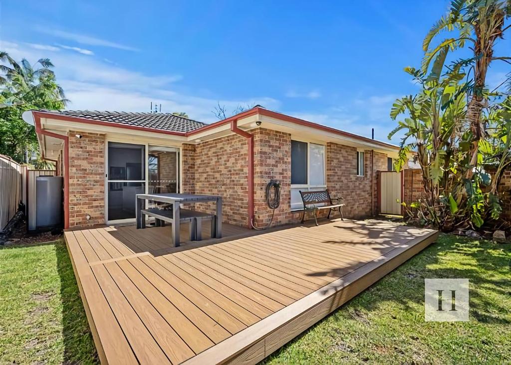 a wooden deck in front of a house at Pete's Retreat -500m from the beach in Norah
