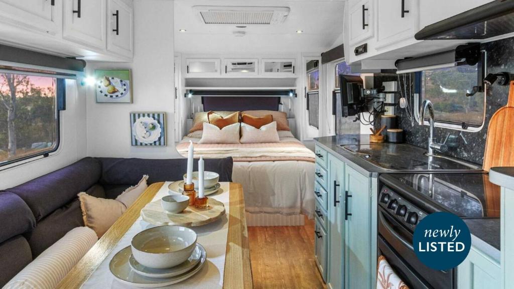 a kitchen and living room in an rv at Vineyard Farmstay in Clare