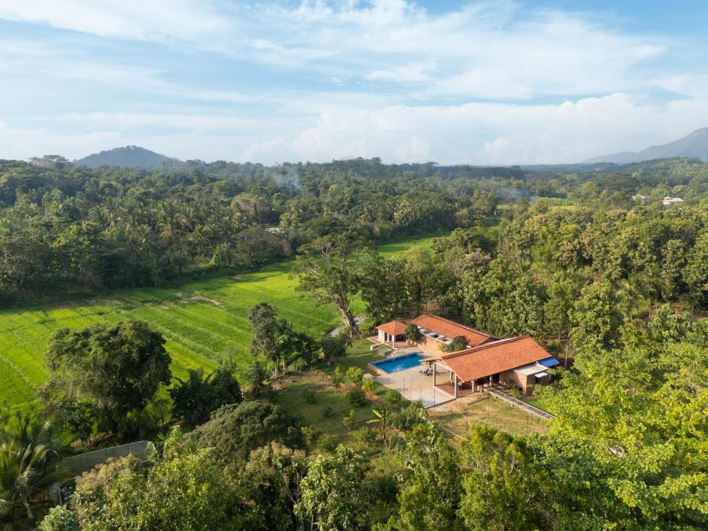 an aerial view of a house in the middle of a field at Villa Mankani Dambulla, centrally located in the cultural triangle in Dambulla