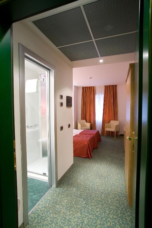 Postel nebo postele na pokoji v ubytování Hotel Senator